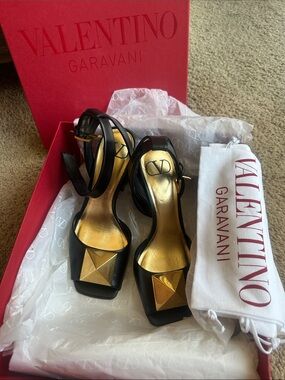 Valentino Garavani Black Leather Heels with Gold Pyramid Accent